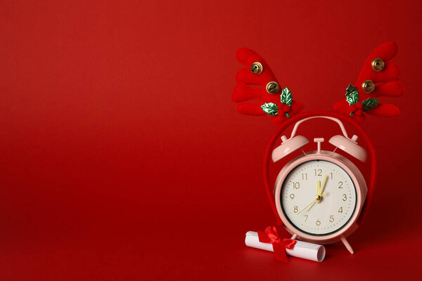 Clock with deer horns, new year concept.