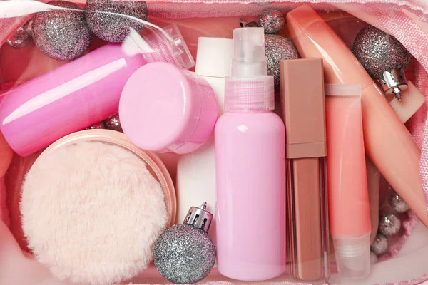 Cosmetics and balls in cosmetic bag, close up