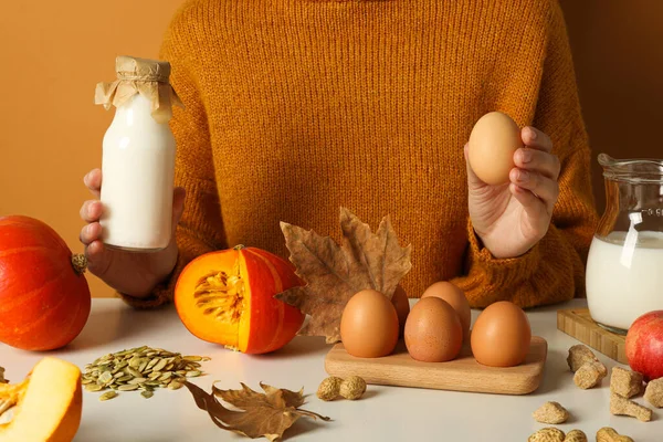Eggs, milk and pumpkin, autumn baking concept.