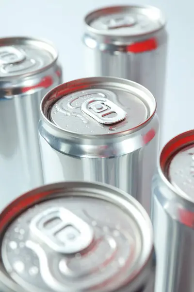 Close-up view of shiny tin cans for drinks
