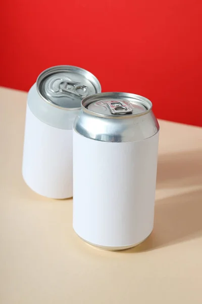Tin cans for drinks on a light background