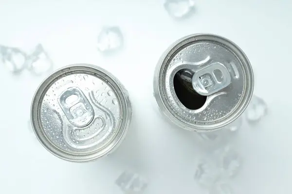 Tin cans for drinks with ice cubes