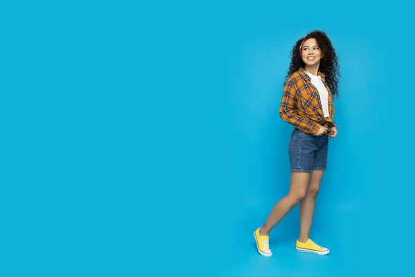 stock image Young attractive girl on a blue background