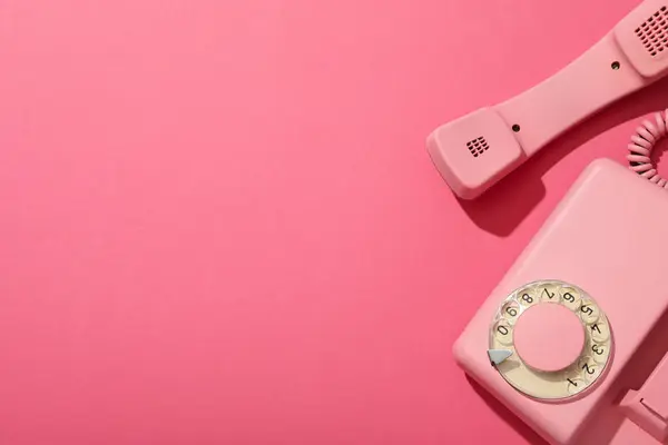 Stock image Landline phone on pink background, space for text