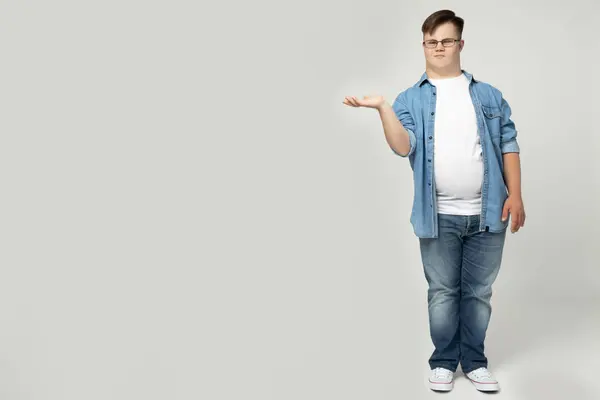 stock image A smiling young man with Down syndrome poses for the camera