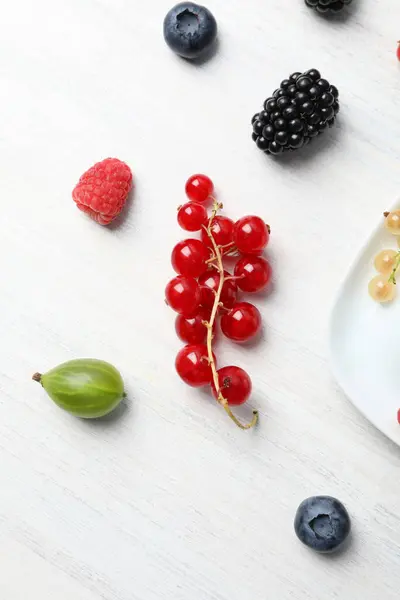 Ripe berries on the table on a light background.