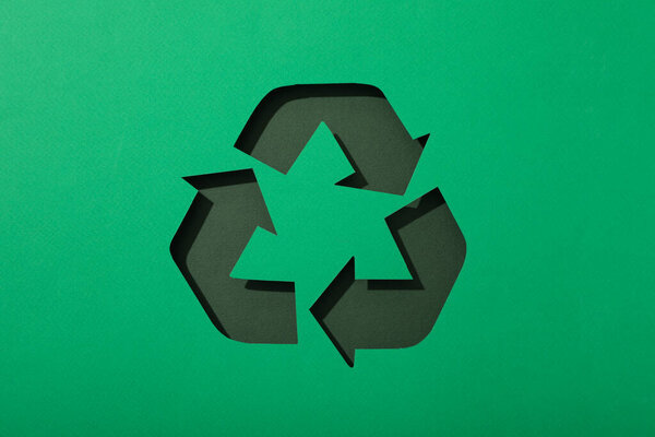 Material recycling sign on a green background