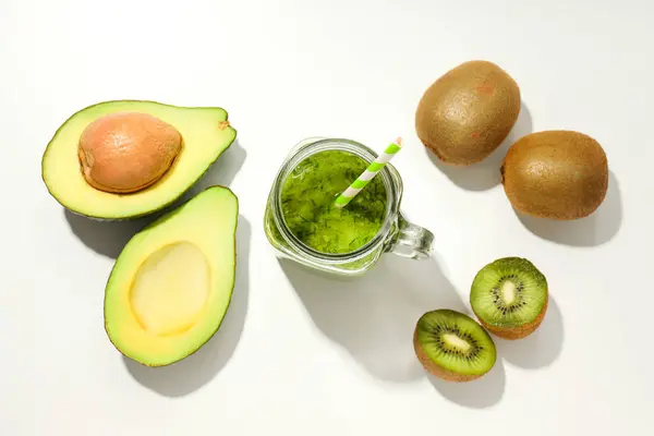 Smoothie with avocado and kiwi on a light background