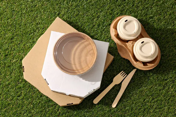 Ecological packaging for food delivery, on the grass.