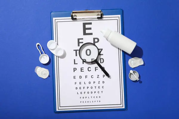 stock image Contact lenses with accessories and a sight test plate