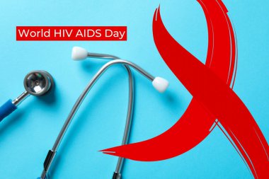 AIDS günü, fonendoskop ve mavi arkaplanda kırmızı kurdele.