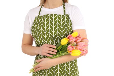 PNG, 8 Mart. Beyaz bir arka planda izole edilmiş önlüklü bir kızın ellerinde bir buket lale..