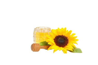 Bir bardak bal ve ayçiçeğinin yanında, beyaz üzerine izole edilmiş, PNG