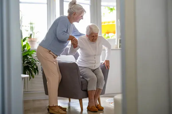 stock image Elderly woman with her caregiver at nursing home