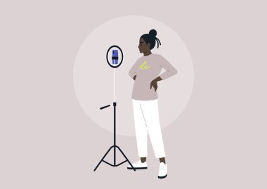 Bir Gen Z blogcusu video kaydetmek için cep telefonu ve tripodunu kullanıyor