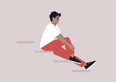 Genç bir beyaz erkek merdivenlerde oturuyor, kulaklıklarından müzik sesi geliyor.