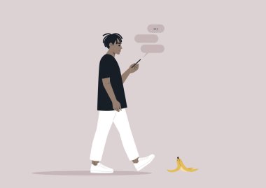 Akıllı telefonlarına bağımlı genç bir Afrikalı erkek. Yolda muz kabuğunu görmezden geliyor.