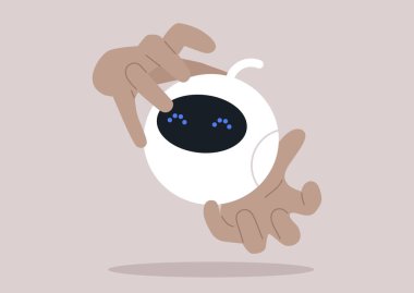 İnsanlar ve makineler arasında bir bağ kuran, eğlenceli küresel bir robotla uğraşan eller.