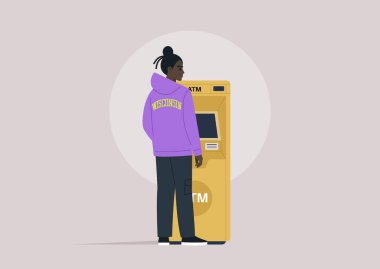 Kapüşonlu ve kargo pantolonlu genç bir adam, arkadan görülüyor, ATM 'nin yanında duruyor ve para çekiyor.