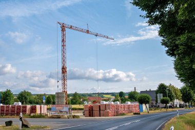 Germany, Dresden, Circa 2022. Mobile construction crane at the construction site. Start of construction.