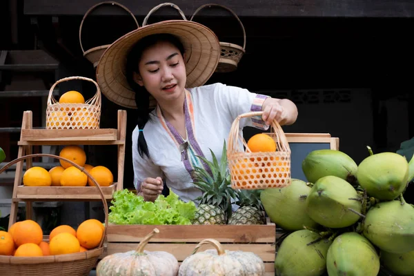 Native Asia woman selling fruits at the farm stay, Homestay at Thailand Loei