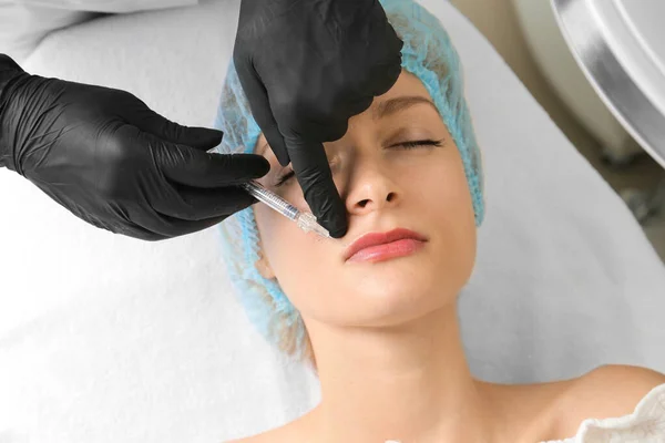 Face and body treatments. The concept of maintaining health, youth and beauty. Face masks, modern cosmetology, beautician tools, hands with gloves. Beauty techniques.