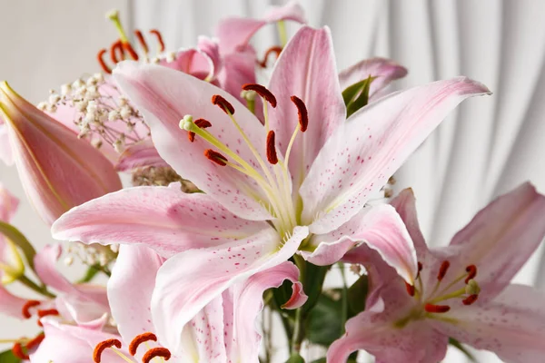 stock image Bouquet of pink lilies on a white background close-up. Lily flowers as a background.