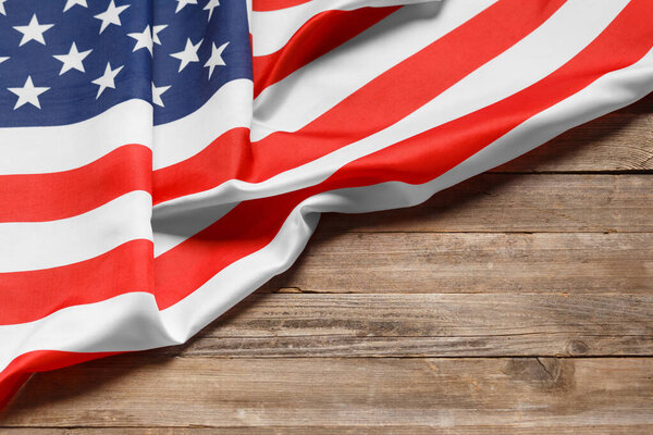 Stars and stripes american flag on rustic wooden background, copy space. The pride of the American people. Symbol of independence, freedom and patriotism in the USA