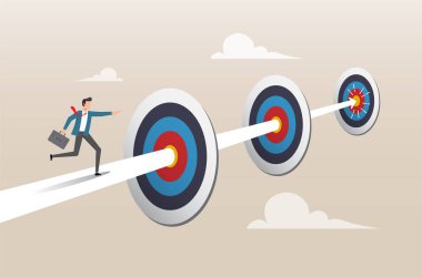 Güven işadamı hedeflerin arasında ok üzerinde koşuyor