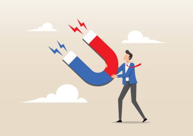 Tüm faydaları çekmek için yüksek güçlü mıknatıs tutan bir iş adamı