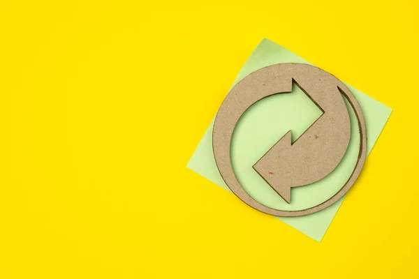 European recycling symbol from cardboard and paper packaging with copy space.