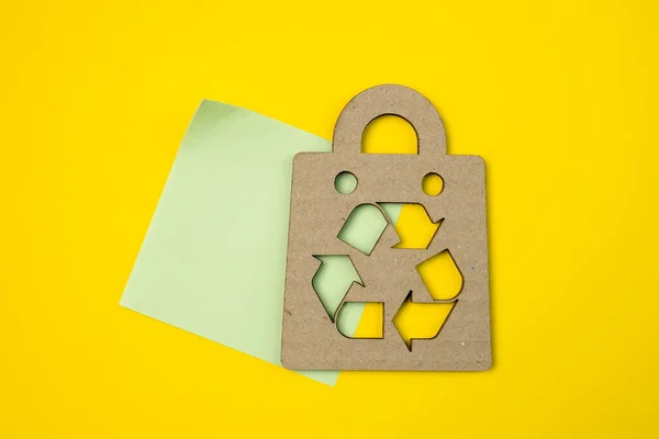 Cardboard bag symbol with recyclable or recycling logo. Recyclable package with free copyspace for creativity ideas text.