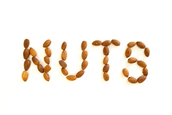 Das Wort Nüsse Besteht Aus Mandelnüssen Vitamin Bio Proteinnahrung Ansicht — Stockfoto