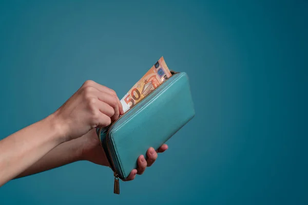 stock image Woman hand holding euro bills in wallet. Saving money.