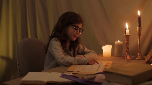 Girl Glasses Learns Letters Light Candles Tired Exhaling She Leans — Stock Video