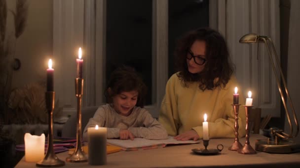 Mother Helps Homework Praises Hugs Her Daughter Candlelight — Stok video