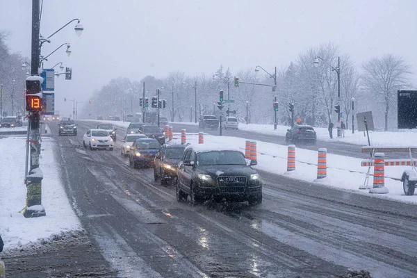 stock image Montreal, Canada - 16 November 2022: Traffic on Park Avenue during first snow storm of the season.