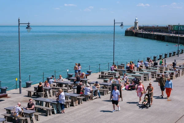 stock image Folkestone, UK - 9 July 2023: Outdoor dining terrace, Folkestone Harbour Arm, Kent