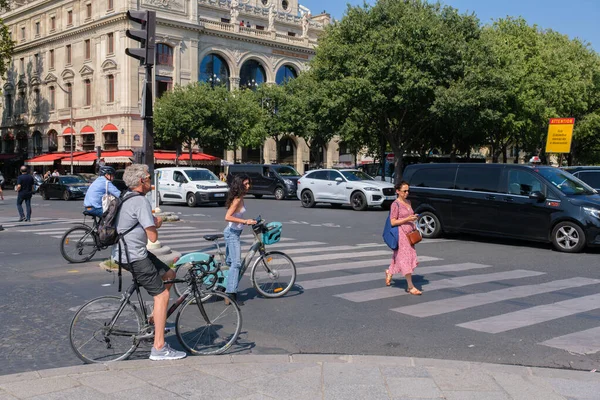 stock image Paris, FR - 31 August 2022: People riding bikes in Paris