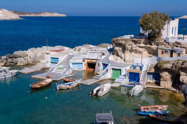 Milos, GR - 28 September 2024: Traditional fishermen houses and boat shelters known as Syrmata clipart