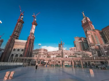 Skyline with  Abraj Al Bait (Royal Clock Tower Makkah) (right) in Makkah, Saudi Arabia. The tower is the tallest clock tower in the world at 601m (1972 feet), built at a cost of USD1.5 billion. clipart