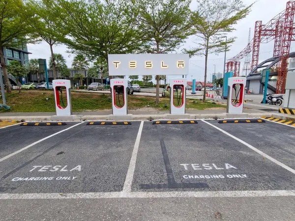 stock image KUANTAN, PAHANG, MALAYSIA - JUNE 21, 2024: Tesla superchargers located near to Kuantan City Council office. Global electric vehicles (EV) sales currently on decline due to low demand.