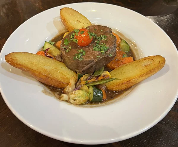 stock image Beef stew with potatoes on white plate