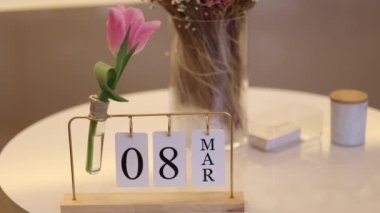 Eight march on calendar in flower shop. Preparing for holiday. Womans day.