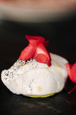 Curd spread served with a sprig of fir tree, parsley and an edible flower. High quality photo