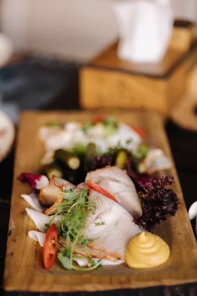 stock image Traditional Transkarpatian dish. Sliced pork lard with chilli pepper and mustard. Served on a wooden plates. Ukrainian dish. High quality photo