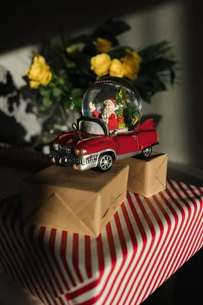 Retro toy Santa car on Christmas gifts. . High quality photo