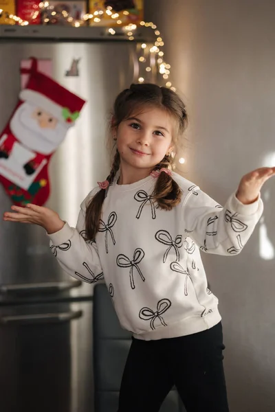 Beautiful five year old girl preparing for Christmas. Winter holidays. New year mood. High quality photo