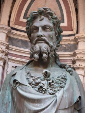 The bronze statue of St. John the Baptist 1412-1416 by Lorenzo Ghiberti in the external niches of the church of Orsanmichele in Florence, Italy. clipart