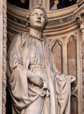 The statue of Saint Philip 1410-1412 by Nanni di Banco in the external niches of the church of Orsanmichele in Florence, Italy. clipart